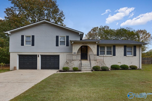 tri-level home featuring a front yard and a garage