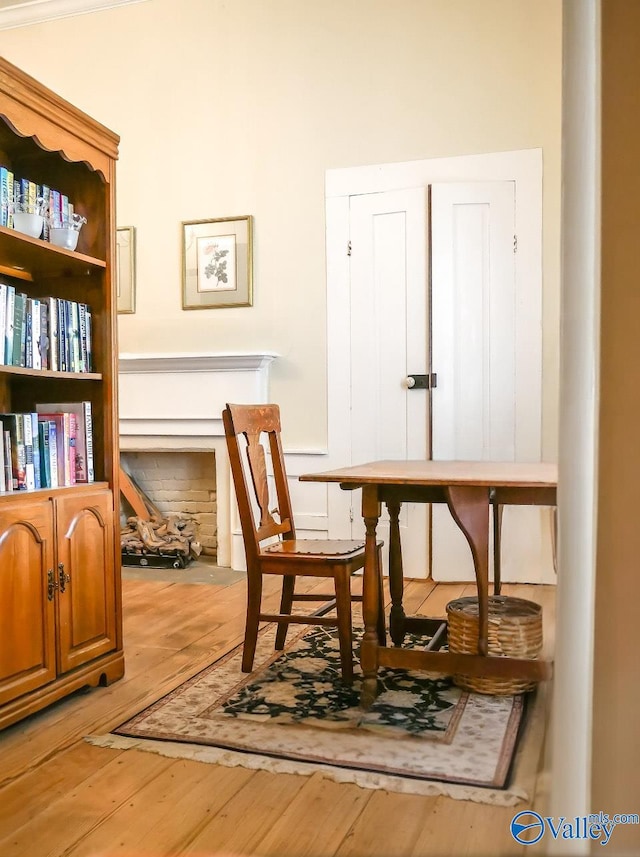 sitting room with wood-type flooring