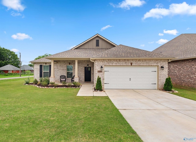24009 Quints Dr, Athens, AL 35613 - view of front of property with brick siding, a garage, a front yard, and driveway