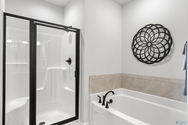 24009 Quints Dr, Athens, AL 35613 - bathroom with a stall shower and a bath