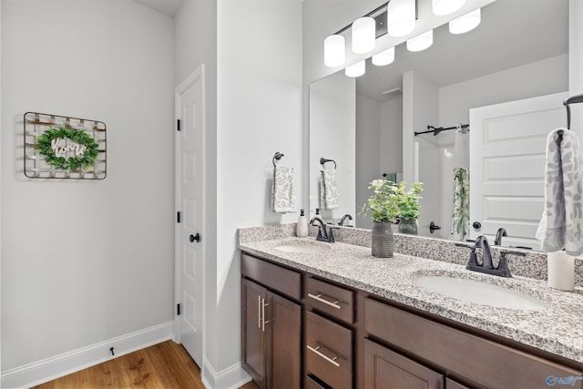 24009 Quints Dr, Athens, AL 35613 - full bath with double vanity, wood finished floors, baseboards, and a shower