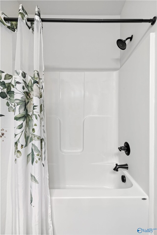 24009 Quints Dr, Athens, AL 35613 - bathroom featuring shower / bath combo with shower curtain