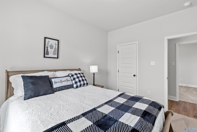 24009 Quints Dr, Athens, AL 35613 - bedroom with baseboards, wood finished floors, and carpet flooring
