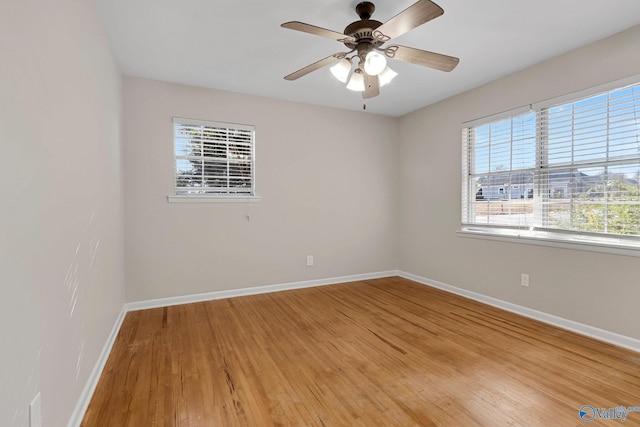 spare room featuring ceiling fan and hardwood / wood-style floors