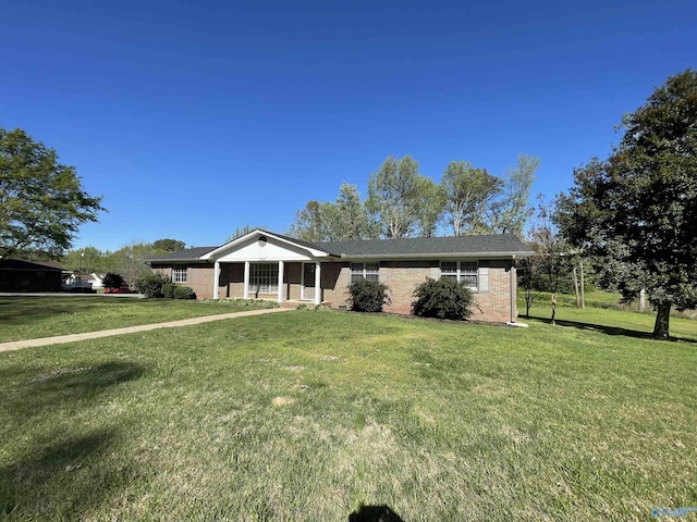 ranch-style house with a front yard