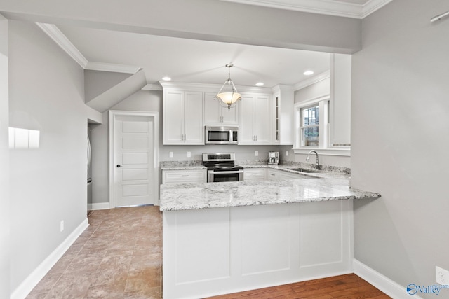 kitchen with light stone counters, stainless steel appliances, a peninsula, a sink, and white cabinets