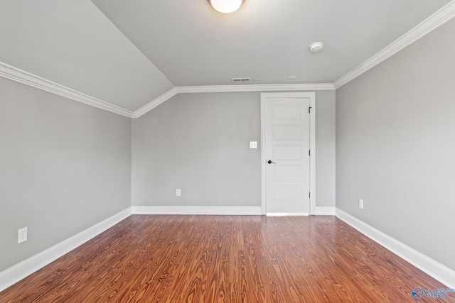 additional living space featuring vaulted ceiling, wood finished floors, visible vents, and baseboards