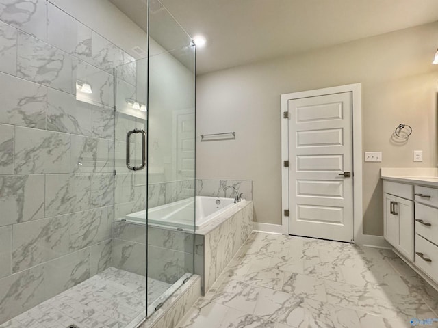 bathroom featuring vanity and separate shower and tub