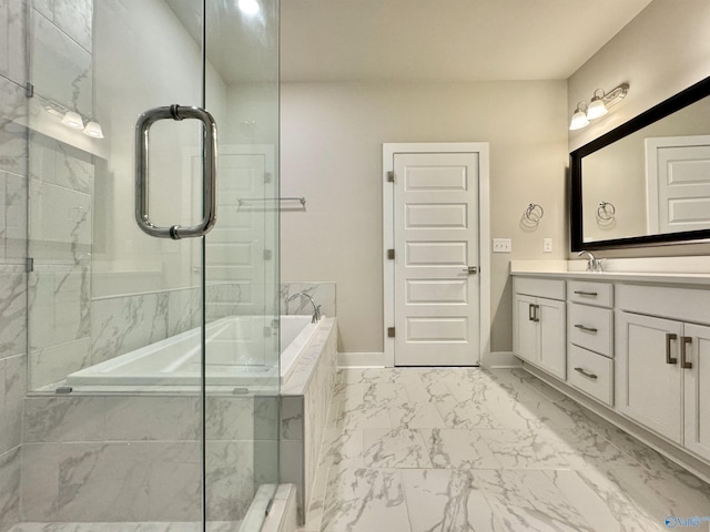 bathroom with a relaxing tiled tub and vanity