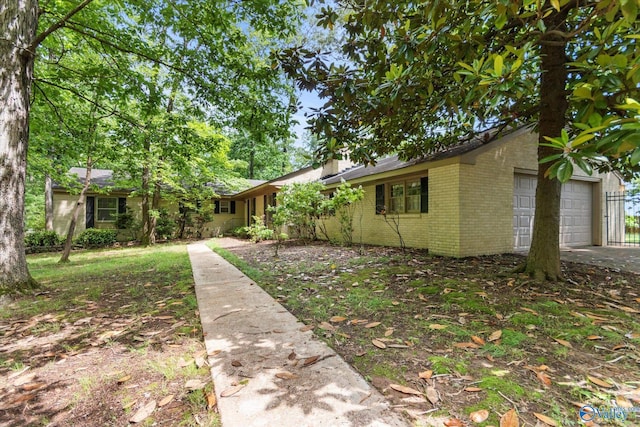 105 Hastings Rd, Athens, AL 35613 - ranch-style home featuring brick siding, concrete driveway, and an attached garage