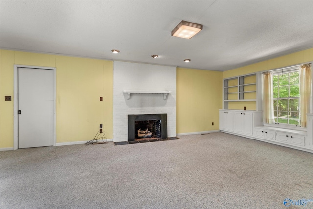 105 Hastings Rd, Athens, AL 35613 - unfurnished living room with baseboards, carpet floors, and a fireplace