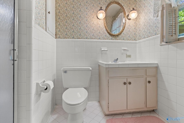 105 Hastings Rd, Athens, AL 35613 - full bath featuring wallpapered walls, tile walls, wainscoting, vanity, and toilet