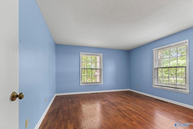 105 Hastings Rd, Athens, AL 35613 - spare room featuring a textured ceiling, wood finished floors, and baseboards