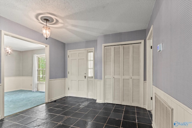 105 Hastings Rd, Athens, AL 35613 - entryway with wainscoting and a textured ceiling