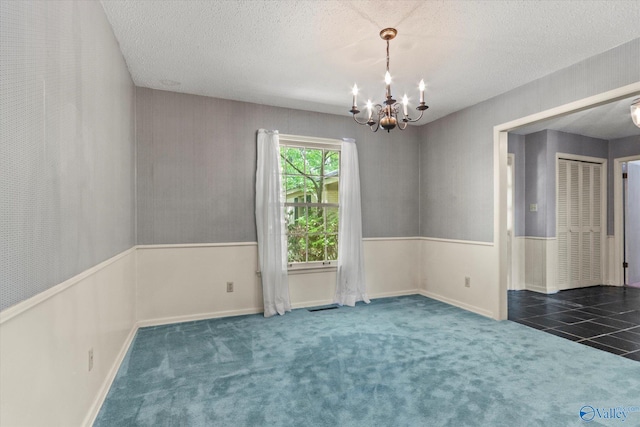 105 Hastings Rd, Athens, AL 35613 - carpeted spare room featuring a chandelier, a textured ceiling, and baseboards