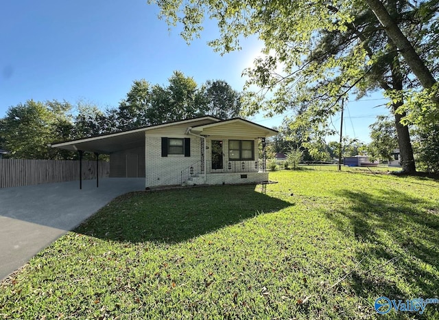 view of front of property with a carport and a front yard