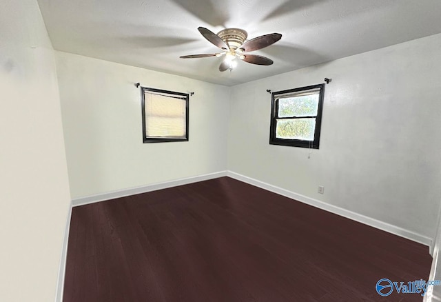 spare room with ceiling fan and hardwood / wood-style floors