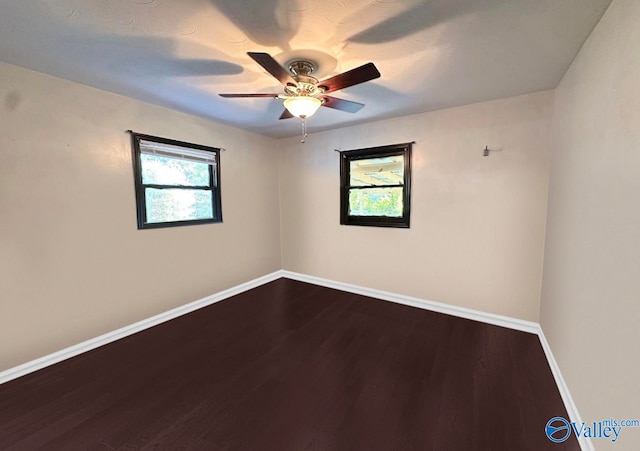 spare room with wood-type flooring and ceiling fan