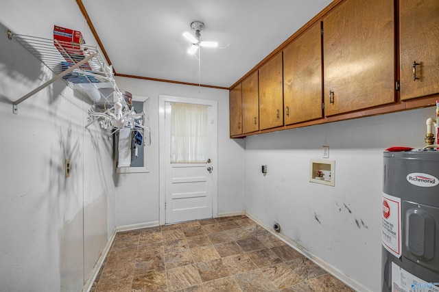 laundry area featuring water heater, stone finish floor, hookup for an electric dryer, hookup for a washing machine, and cabinet space