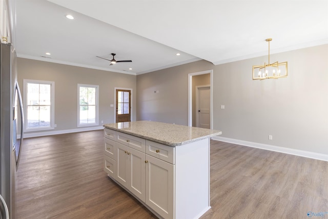 kitchen with baseboards, open floor plan, light wood-type flooring, ceiling fan with notable chandelier, and stainless steel refrigerator with ice dispenser