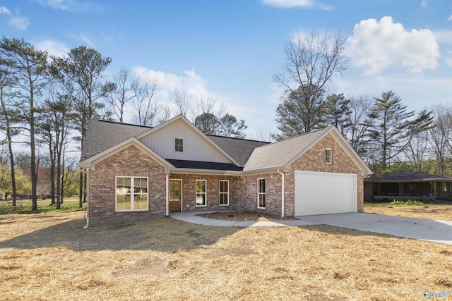view of front of house featuring brick siding, a front lawn, roof with shingles, driveway, and an attached garage