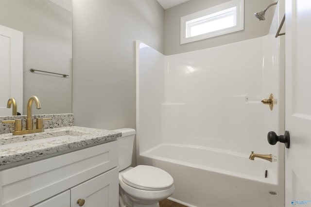 full bathroom featuring shower / bathing tub combination, toilet, and vanity