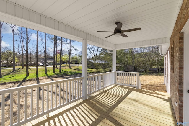 wooden deck featuring a ceiling fan