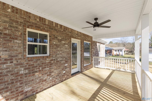 wooden deck with ceiling fan