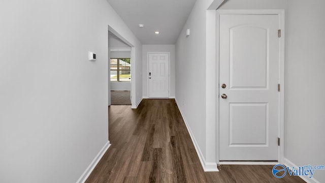 hall with dark hardwood / wood-style flooring