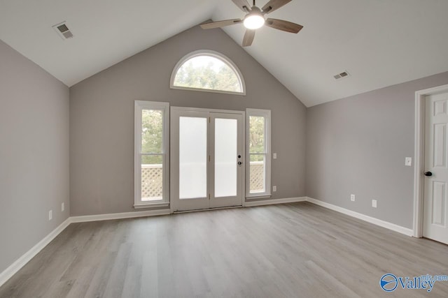 interior space featuring visible vents, light wood-style flooring, and baseboards