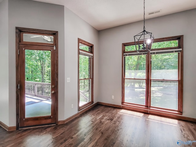 entryway featuring dark hardwood / wood-style floors and a notable chandelier