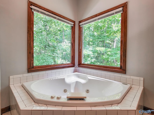 bathroom featuring tiled bath