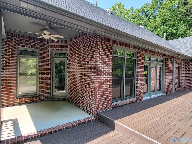 wooden deck featuring ceiling fan