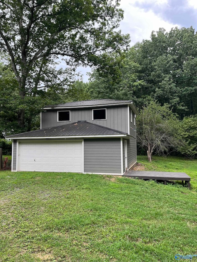 garage with a lawn