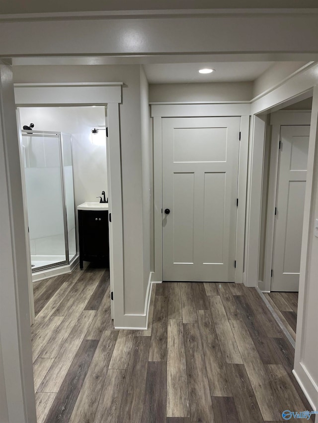 hallway featuring dark wood-type flooring