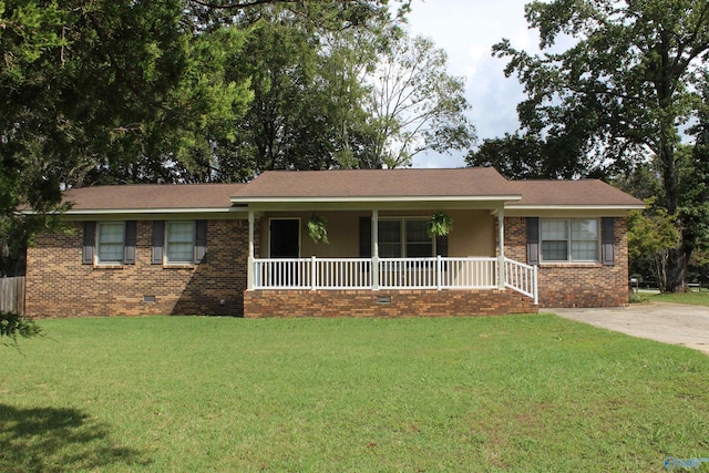 ranch-style home with a front yard and a porch