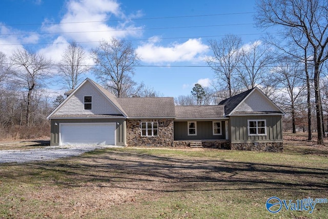 view of front of house with a shingled roof, dirt driveway, stone siding, board and batten siding, and a front yard