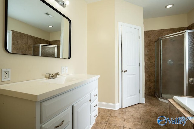 full bathroom featuring visible vents, a shower stall, vanity, and tile patterned floors