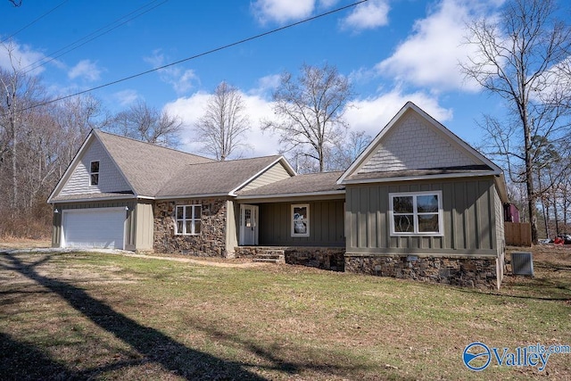 view of front of property featuring a garage, driveway, a shingled roof, a front lawn, and board and batten siding