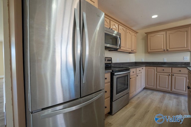kitchen featuring light wood finished floors, light brown cabinets, appliances with stainless steel finishes, and recessed lighting
