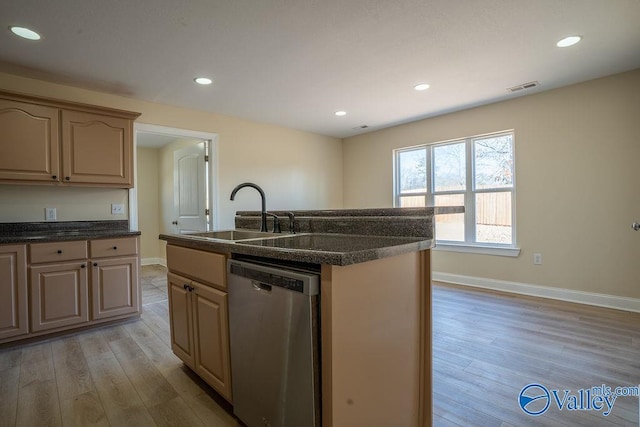kitchen featuring baseboards, visible vents, stainless steel dishwasher, light wood-style floors, and a sink