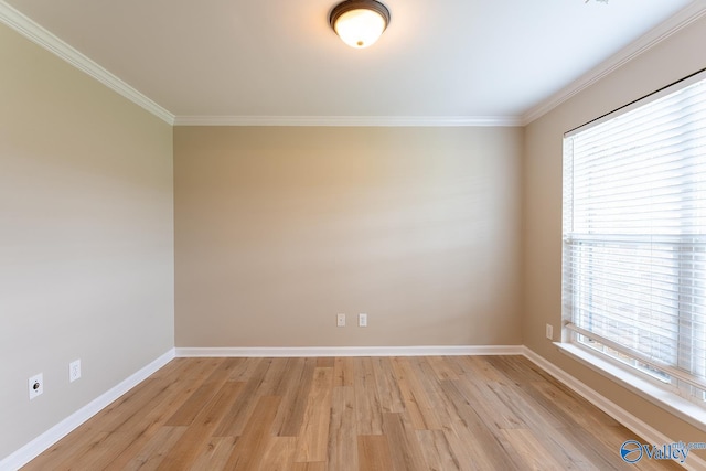 spare room with crown molding and light hardwood / wood-style floors