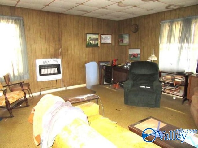 living room with a drop ceiling