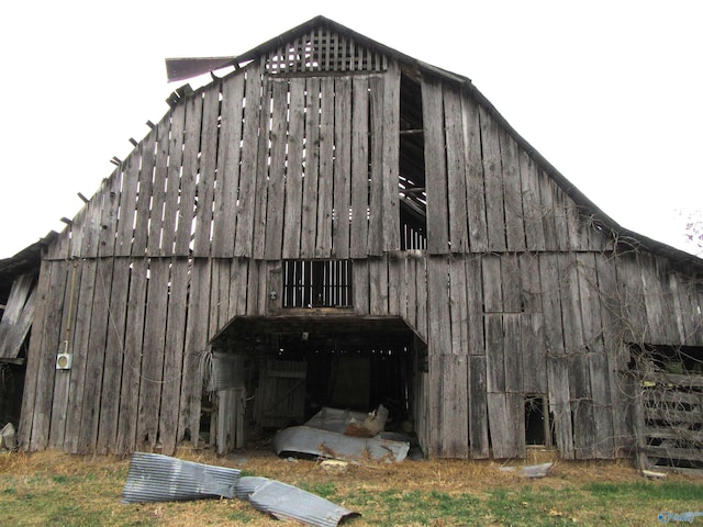 view of home's exterior with an outdoor structure