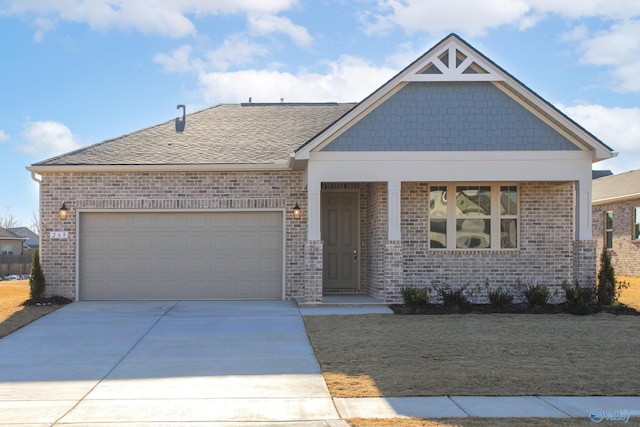 view of front of house featuring concrete driveway, brick siding, an attached garage, and a shingled roof