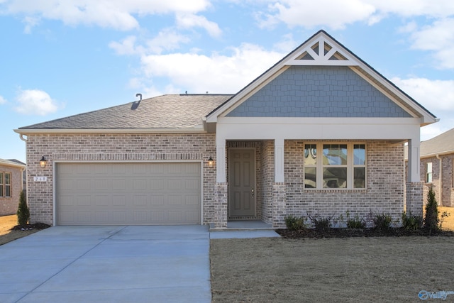 craftsman inspired home with driveway, brick siding, and an attached garage