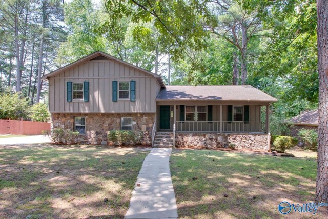 split level home with a front yard