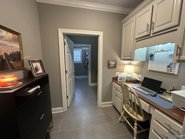 tiled home office featuring ornamental molding