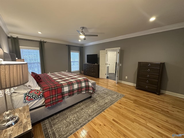 bedroom with multiple windows, ceiling fan, light hardwood / wood-style flooring, and ornamental molding