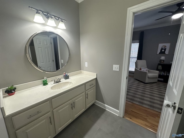 bathroom with crown molding, tile patterned flooring, vanity, and ceiling fan